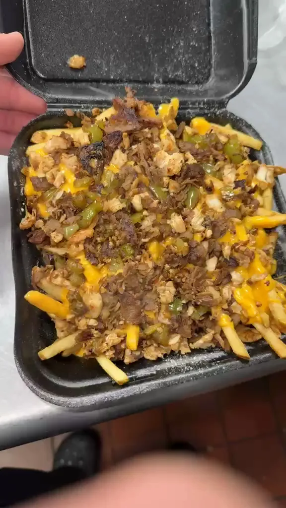 Fries loaded with chopped steak, peppers, onions and melted cheese sauce